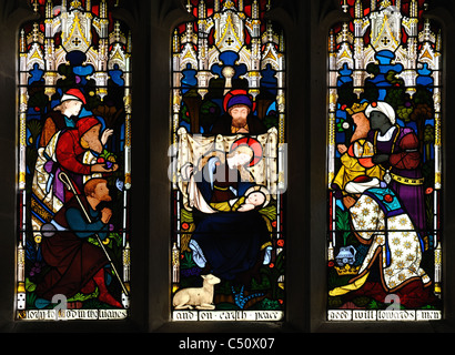 Nativity stained glass in East Window, St. Andrew`s Church, Coln Rogers, Gloucestershire, England, UK Stock Photo